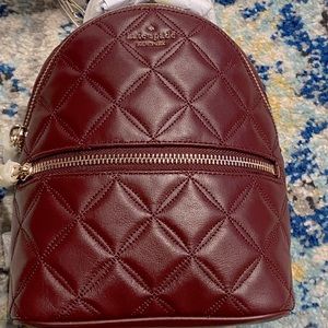Selling a Kate Spade backpack purse.